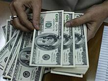 Доллар замедлил снижение к мировым валютам