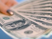 Средний курс доллара США со сроком расчетов "завтра" по итогам торгов на 19:00 мск составил 65,1677 руб.