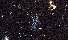 Таинственные «голубые пятна» могли формироваться в результате «падения галактик на живот»