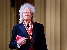 Гитарист Queen посвящен в рыцари Карлом III