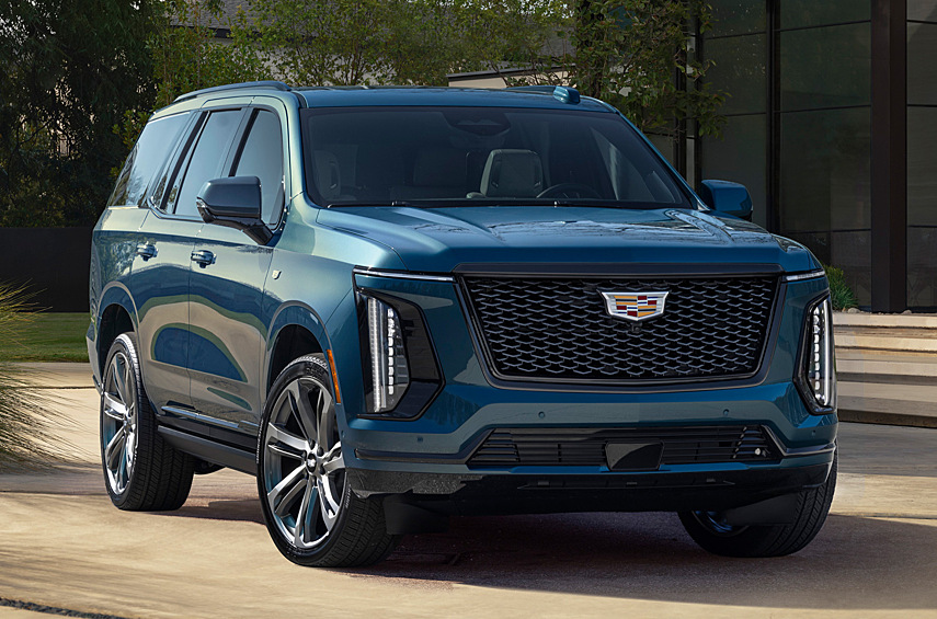 Cadillac Escalade. Грандиозный «Кэдди» модернизирован прошлым летом и теперь смотрится еще причудливее с огромными вертикальными фарами и стандартными 22-дюймовыми колесами. Мало? Тогда есть опциональные диаметром 24 дюйма. Кроме того, в гамме появились три новых цвета — зеленый Aegean Stone, синий Deep Sea Metallic и бежевый Latte Metallic.