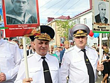 Священник оправдался за одинаковые портреты 9 мая