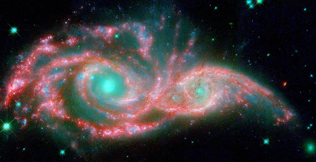 "Глаза в небе". Галактики NGC 2207 и IC 2163 во время слияния