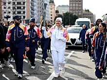 Глава МОК Ковентри пронесла олимпийский огонь по Милану