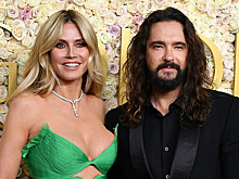 Хайди Клум вышла на пляж с полотенцем с изображением лица молодого мужа