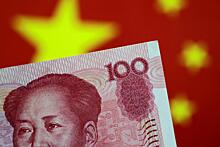 Китай снова девальвирует юань