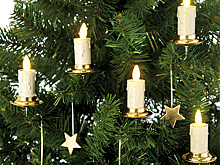 Жителям ФРГ посоветовали согреваться на Рождество свечами с елки