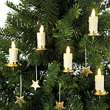 Жителям ФРГ посоветовали согреваться на Рождество свечами с елки