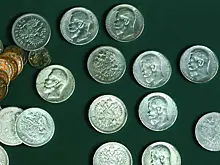 Столичные археологи отреставрировали клад с монетами времен Николая II
