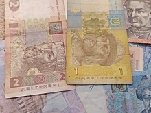 Bloomberg: МВФ потребовал девальвировать гривну