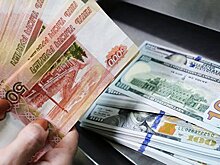 Банк России поднял курсы доллара и евро