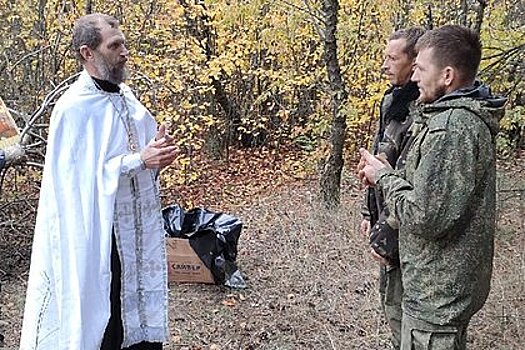 Российский священник покрестил участников спецоперации в мешках для «груза 200»