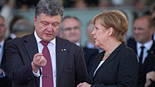 Меркель обещала Путину поговорить с Порошенко о ситуации на Украине