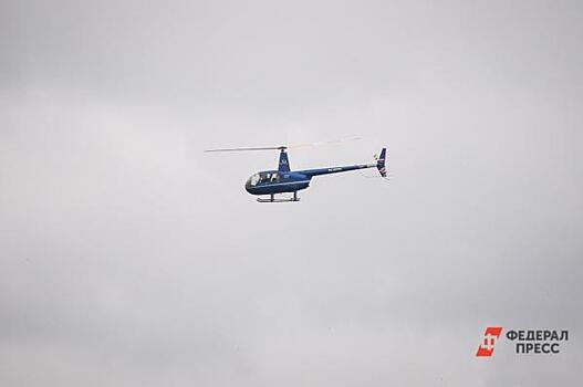 Власти Камчатки назвали возможную причину незапланированной посадки вертолета на вулкан
