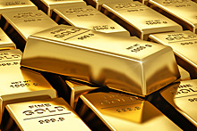 Золото подешевело до минимума за 4 месяца на росте доллара и уходе в риск
