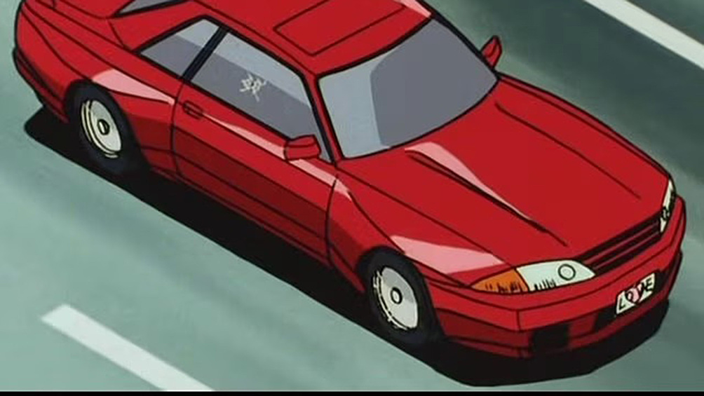 Когда в кадре появляется Nissan Skyline GT-R R32, сразу понятно – сейчас будет жарко. Не зря же этот монстр получил прозвище «Годзилла». В «Городском охотнике» его использовали как таран, но настоящая стихия этого автомобиля – гоночные трассы, а не уличные разборки.  С 1989 по 1994 год эта машина доминировала в японском чемпионате, и легко понять почему. Под капотом – рядная «шестёрка» RB26DETT (2.6 литра, 280 л.с.), а полный привод ATTESA E-TS делал его практически недосягаемым в поворотах.