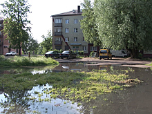 В Гусеве сильный ночной ливень подтопил дворы и поднял уровень воды в реке