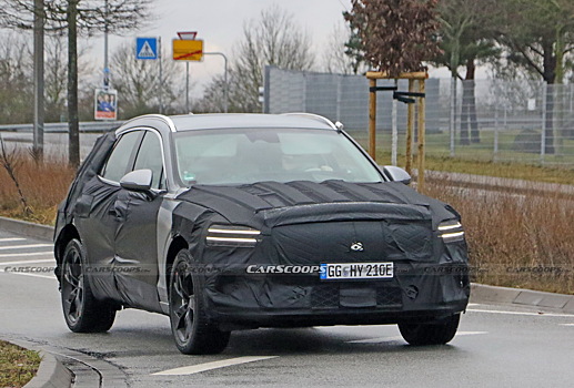  		 			?Электрокросс Genesis eGV70 дебютирует под тяжелым камуфляжем 		 	