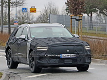  		 			?Электрокросс Genesis eGV70 дебютирует под тяжелым камуфляжем 		 	