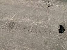 На Боровой после укладки асфальта осталась дыра