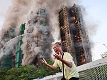 Число погибших на пожаре в Гонконге достигло 94 человек