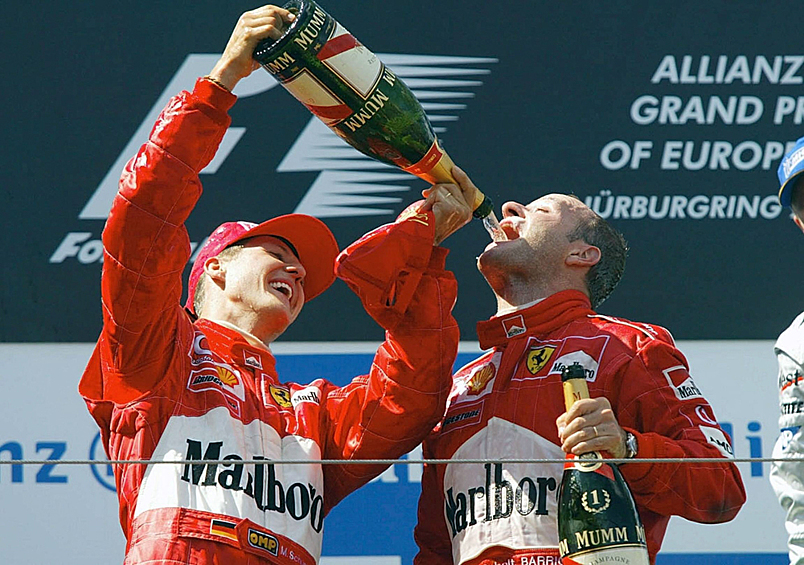 Михаэль Шумахер и Рубенс Баррикелло празднуют победу, 2002 год