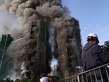 Число погибших при пожаре в небоскребах Гонконга возросло