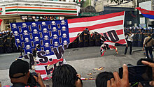 В Маниле сожгли американские флаги на акции против Трампа