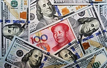 Банк Китая установил рекордный с начала года курс юаня к доллару