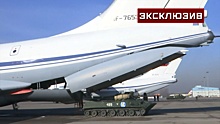 Крылатые тяжеловозы: кадры погрузки техники российских миротворцев в самолеты ВТА