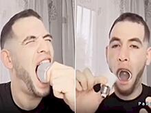 Большеротый экстремал угодил в незавидную ситуацию, засунув в рот лампу: видео