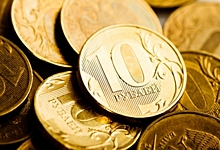 Официальный курс доллара опустился ниже 58 рублей