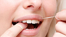 Ученые предупредили об опасности использования зубной нити