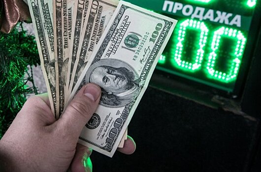 Средневзвешенный курс доллара снизился до 59,09 рубля