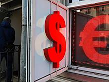 Рубль растет к доллару и евро