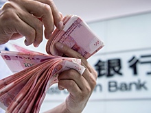 FT: Американскому доллару угрожает поглощение криптоюанем