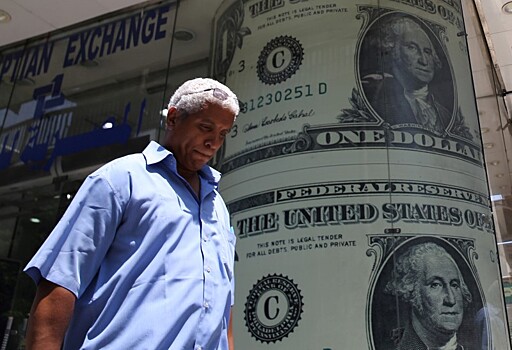 Курс доллара повысился до максимума сессии, лира и аргентинский песо подешевели