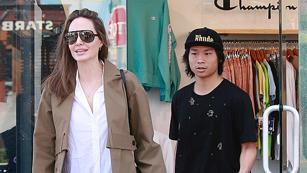 Брюки с разрезами и идеальный тренч в оттенке хаки: Анджелина Джоли на шопинге с сыном