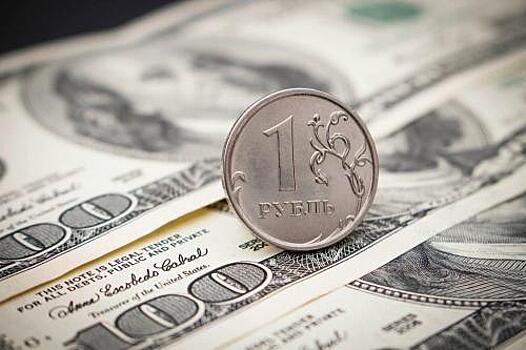 Средневзвешенный курс доллара на 11:30 мск понизился до 63,2 рубля