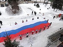 Омичи поддержали олимпийцев 20-метровым российский флагом