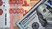 Курс рубля вырос к евро и доллару